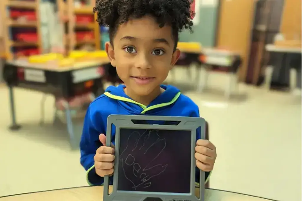 Student holding picture Student holding picture